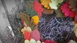 Close up view of autumn coloured needle felted leaf wreath