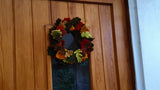Needle Felted Leaf Wreath hung on a wooden door