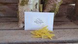 Faux stamens for tulips, yellow in colour, plastic with labelled white envelope