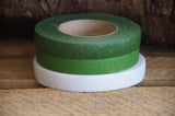 Close up view of florist tape rolls in green and white